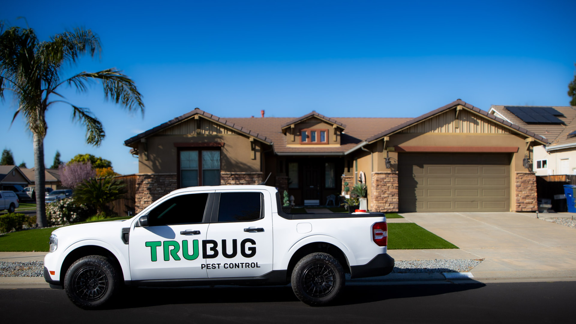TruBug service truck parked in front of a Central Valley home